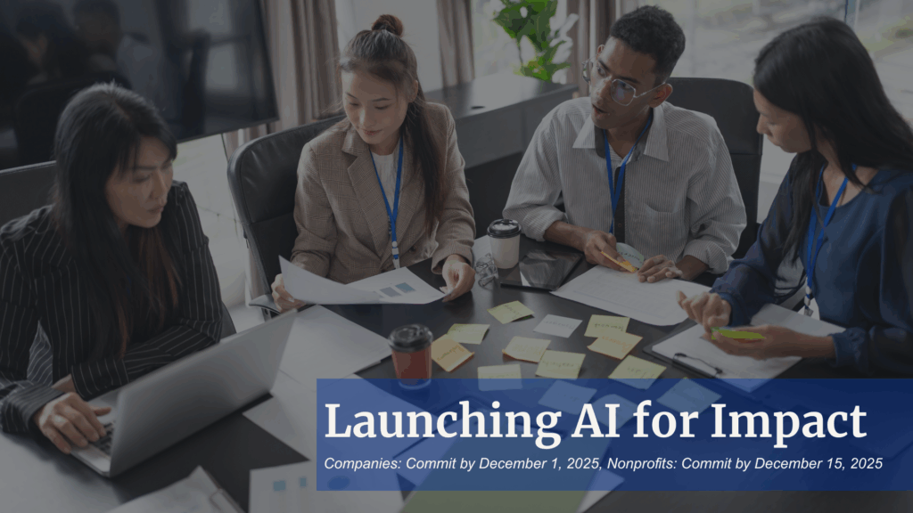 Group of people collaborating at a desk around a computer with deadlines on the AI for Impact program.